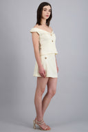 Falda corta detalle botones metalicos